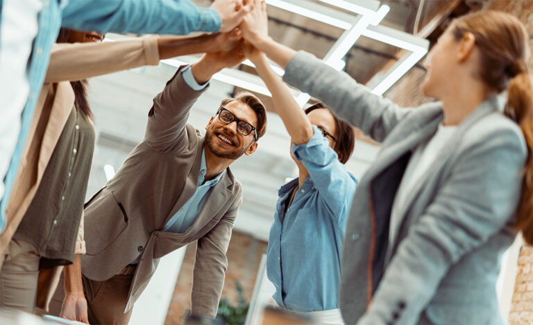 group of coworkers high five