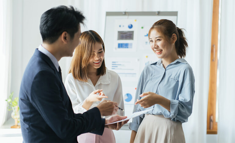 team discusses a business plan in an office